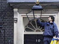 Fitting an energy-saving bulb at No 10